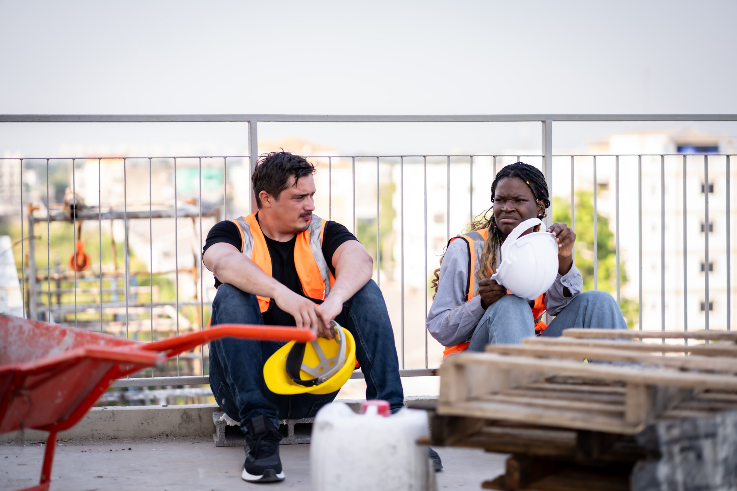 heat exhaustion vs heatstroke - construction workers take a break on urban rooftop 2026 03 24 00 30 08 utc